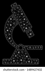 Glowing mesh microscope with glare effect. Abstract illuminated model of microscope icon. Shiny wire frame polygonal network microscope. Vector abstraction on a black background.