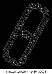 Glowing mesh pill with glare effect. Abstract illuminated model of pill icon. Shiny wire carcass polygonal mesh pill. Vector abstraction on a black background.