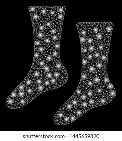 Glowing mesh socks with glitter effect. Abstract illuminated model of socks icon. Shiny wire frame polygonal mesh socks. Vector abstraction on a black background.