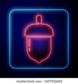 Glowing neon Acorn icon isolated on blue background.  Vector Illustration