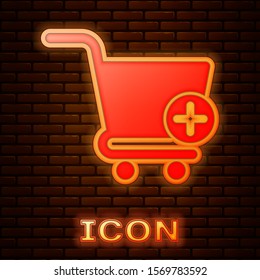 Glowing neon Add to Shopping cart icon isolated on brick wall background. Online buying concept. Delivery service sign. Supermarket basket symbol.  Vector Illustration