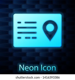 Glowing neon Address book icon isolated on brick wall background. Telephone directory. Vector Illustration