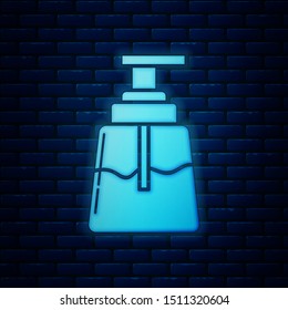 Glowing neon Aftershave icon isolated on brick wall background. Cologne spray icon. Male perfume bottle.  Vector Illustration