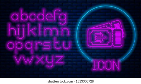 Glowing neon Airline ticket icon isolated on brick wall background. Plane ticket. Neon light alphabet. Vector Illustration