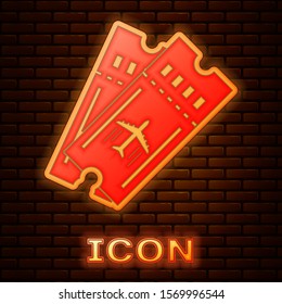 Glowing neon Airline ticket icon isolated on brick wall background. Plane ticket.  Vector Illustration