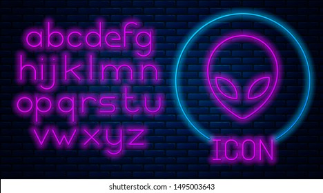 Glowing neon Alien icon isolated on brick wall background. Extraterrestrial alien face or head symbol. Neon light alphabet. Vector Illustration