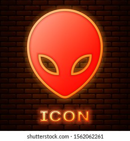 Glowing neon Alien icon isolated on brick wall background. Extraterrestrial alien face or head symbol.  Vector Illustration
