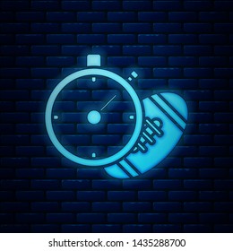 Glowing neon American Football ball and stopwatch icon isolated on brick wall background. Set of sport equipment.  Vector Illustration