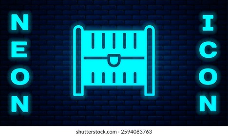 Glowing neon Antique treasure chest icon isolated on brick wall background. Vintage wooden chest with golden coin.  Vector