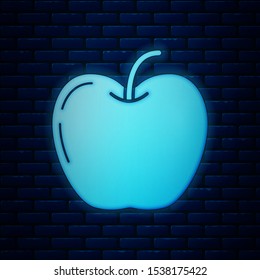 Glowing neon Apple icon isolated on brick wall background. Fruit with leaf symbol.  Vector Illustration