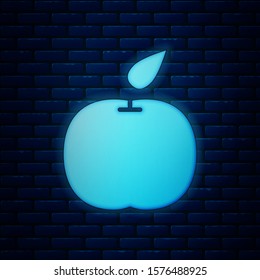 Glowing neon Apple icon isolated on brick wall background. Fruit with leaf symbol.  Vector Illustration