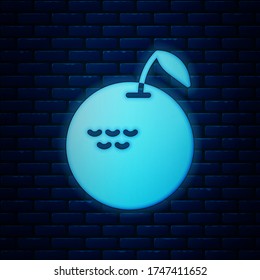 Glowing neon Apple icon isolated on brick wall background. Fruit with leaf symbol.  Vector