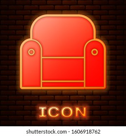 Glowing neon Armchair icon isolated on brick wall background.  Vector Illustration