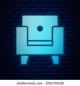 Glowing neon Armchair icon isolated on brick wall background.  Vector