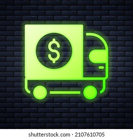 Glowing neon Armored truck icon isolated on brick wall background.  Vector