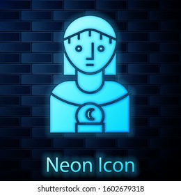 Glowing neon Astrology woman icon isolated on brick wall background.  Vector Illustration