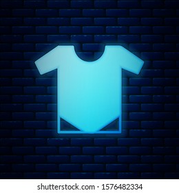 Glowing neon Baby onesie icon isolated on brick wall background. Baby clothes symbol. Kid wear sign.  Vector Illustration