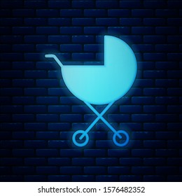 Glowing neon Baby stroller icon isolated on brick wall background. Baby carriage, buggy, pram, stroller, wheel.  Vector Illustration