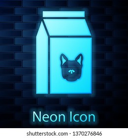 Glowing neon Bag of food for dog icon isolated on brick wall background. Food for animals. Pet food package. Vector Illustration