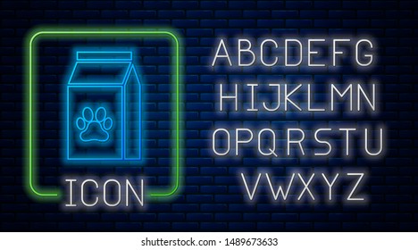Glowing neon Bag of food for pet icon isolated on brick wall background. Food for animals. Pet food package. Dog or cat paw print. Neon light alphabet. Vector Illustration