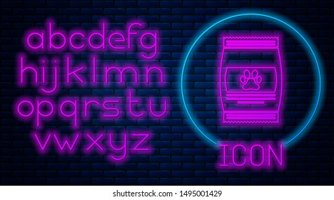 Glowing neon Bag of food for pet icon isolated on brick wall background. Food for animals. Pet food package. Dog or cat paw print. Neon light alphabet. Vector Illustration