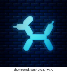 Glowing neon Balloon dog icon isolated on brick wall background.  Vector