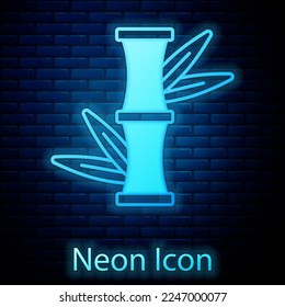 Glowing neon Bamboo icon isolated on brick wall background.  Vector