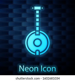 Glowing neon Banjo icon isolated on brick wall background. Musical instrument.  Vector Illustration