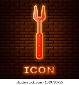 Glowing neon Barbecue fork icon isolated on brick wall background. BBQ fork sign. Barbecue and grill tool.  Vector Illustration