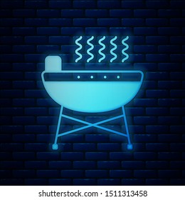 Glowing neon Barbecue grill icon isolated on brick wall background. BBQ grill party.  Vector Illustration