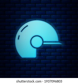 Glowing neon Baseball helmet icon isolated on brick wall background.  Vector