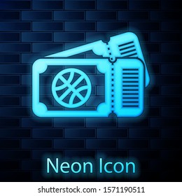 Glowing neon Basketball game ticket icon isolated on brick wall background.  Vector Illustration