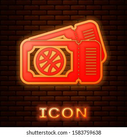 Glowing neon Basketball game ticket icon isolated on brick wall background.  Vector Illustration