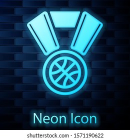 Glowing neon Basketball medal with ribbon icon isolated on brick wall background.  Vector Illustration