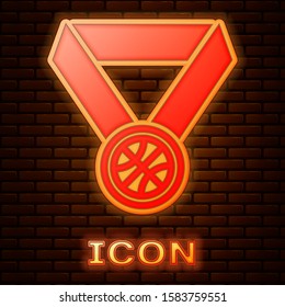Glowing neon Basketball medal with ribbon icon isolated on brick wall background.  Vector Illustration
