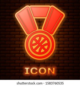 Glowing neon Basketball medal with ribbon icon isolated on brick wall background.  Vector Illustration