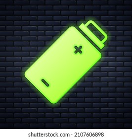Glowing neon Battery charge level indicator icon isolated on brick wall background.  Vector