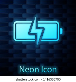 Glowing neon Battery icon isolated on brick wall background. Lightning bolt symbol. Vector Illustration