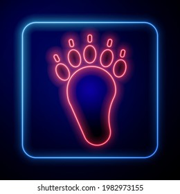 Glowing neon Bear paw footprint icon isolated on black background.  Vector