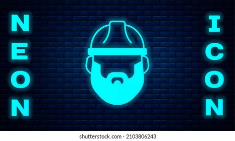 Glowing neon Bearded lumberjack man icon isolated on brick wall background.  Vector