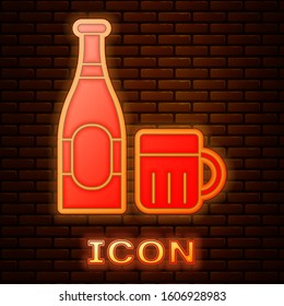 Glowing neon Beer bottle and glass icon isolated on brick wall background. Alcohol Drink symbol.  Vector Illustration