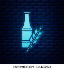 Glowing neon Beer bottle icon isolated on brick wall background.  Vector Illustration