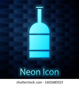 Glowing neon Beer bottle icon isolated on brick wall background.  Vector Illustration