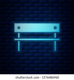 Glowing neon Bench icon isolated on brick wall background.  Vector Illustration