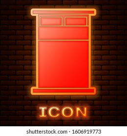 Glowing neon Big bed for two or one person icon isolated on brick wall background.  Vector Illustration