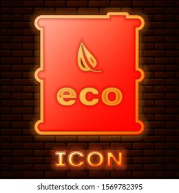 Glowing neon Bio fuel barrel icon isolated on brick wall background. Eco bio and canister. Green environment and recycle.  Vector Illustration
