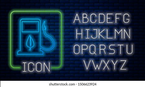 Glowing neon Bio fuel concept with fueling nozzle and leaf icon isolated on brick wall background. Gas station with leaves. Eco refueling. Neon light alphabet. Vector Illustration
