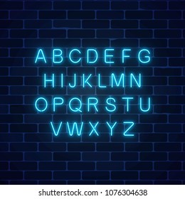 Glowing neon blue color alphabet font on dark brick wall background. Vector neon style letters. You can made your words with it.