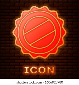 Glowing neon Bottle cap icon isolated on brick wall background.  Vector Illustration