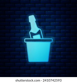 Glowing neon Bottle of champagne in an ice bucket icon isolated on brick wall background.  Vector